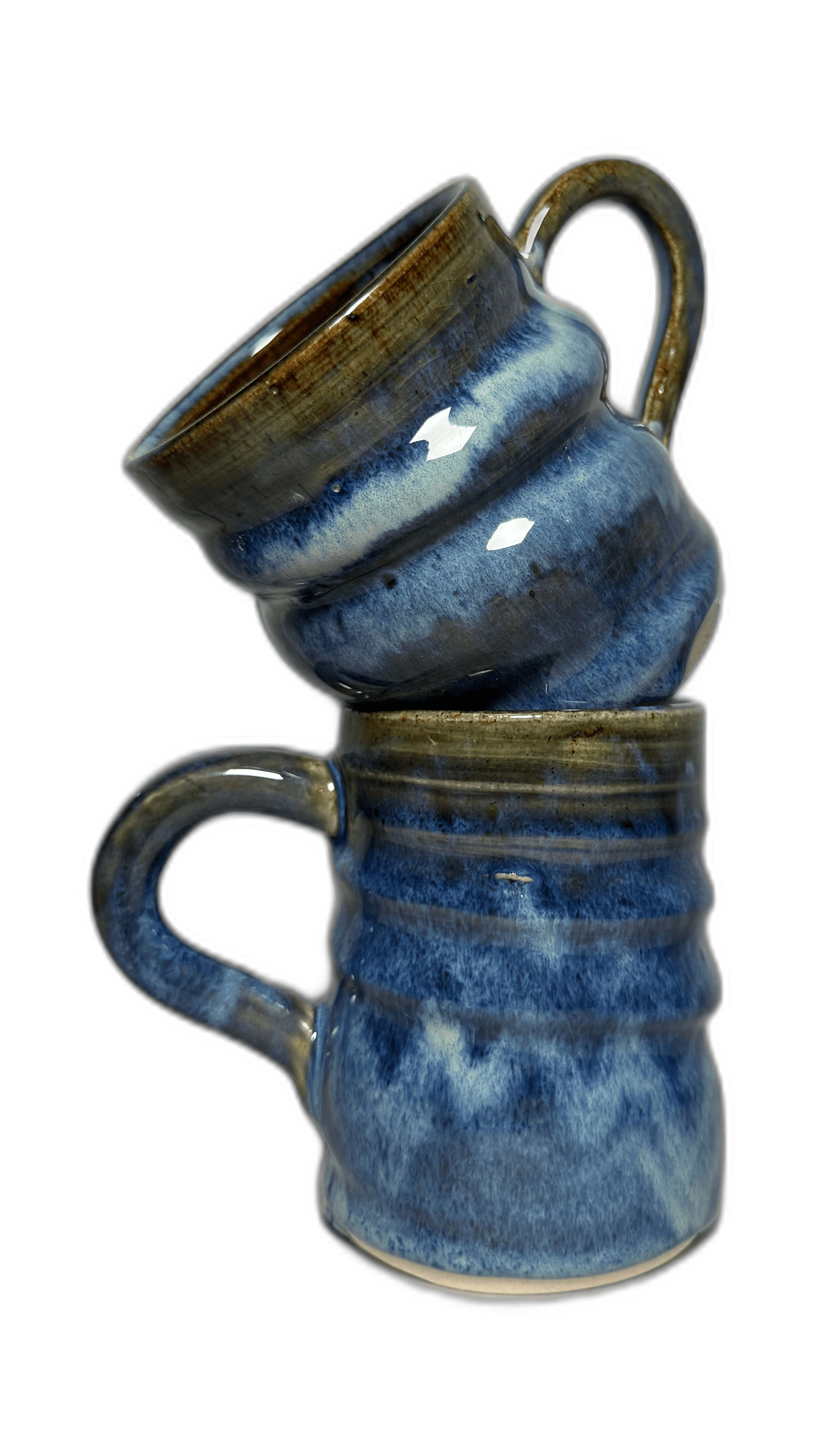 Two blue-glazed mugs photographed for a journal cover