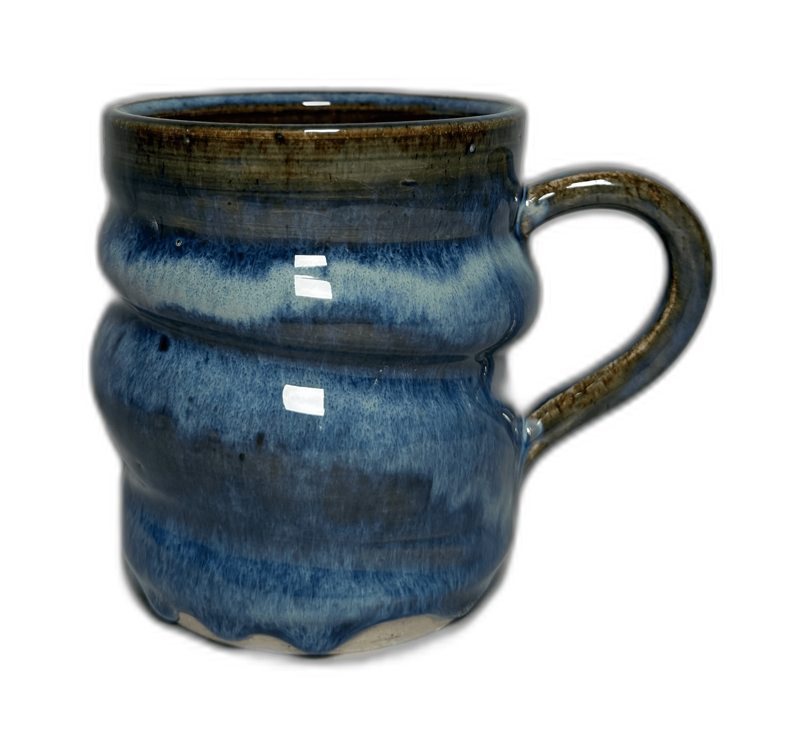 A single blue-glazed mug photographed for a journal cover