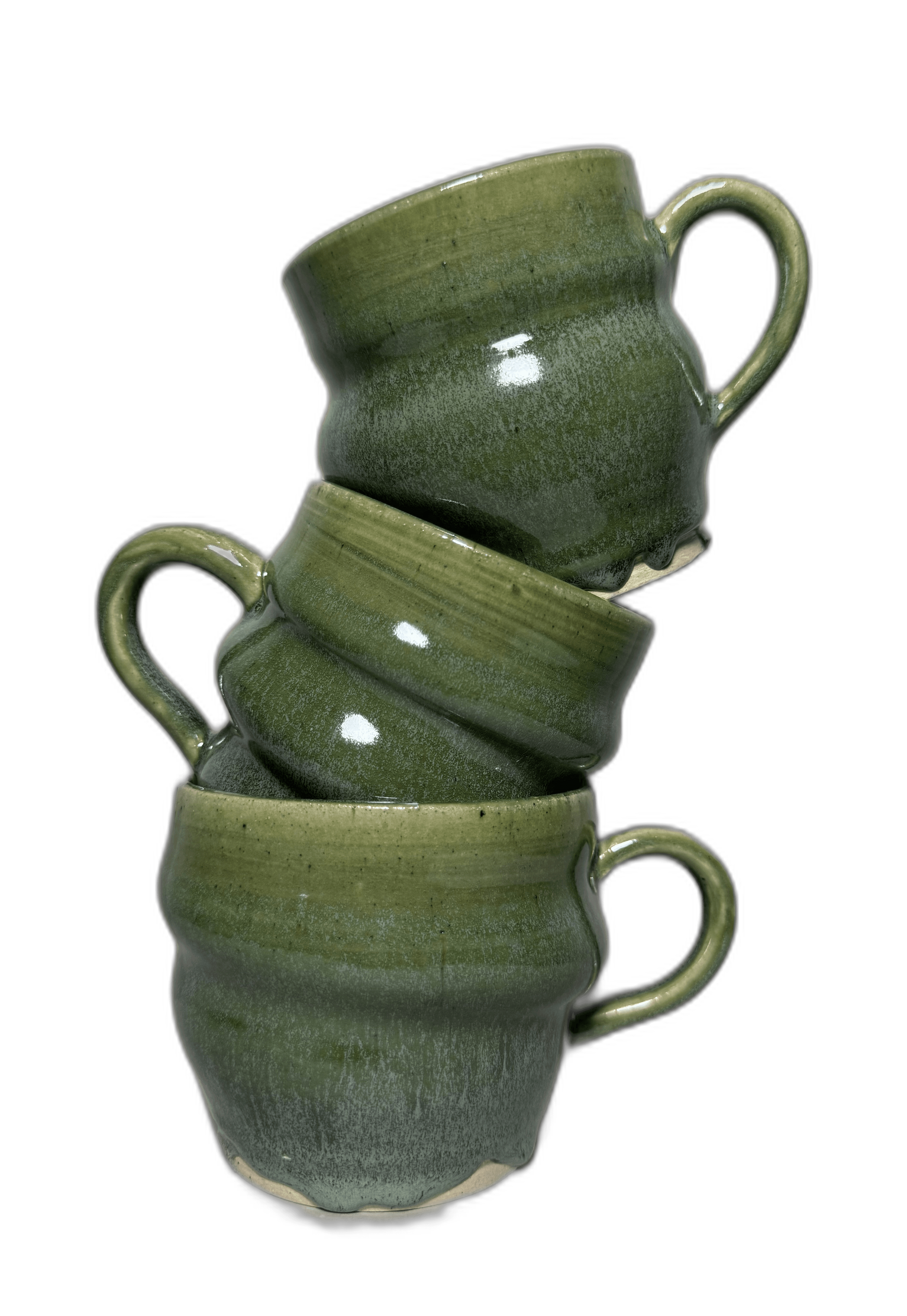 Two green-glazed mugs photographed for a journal cover
