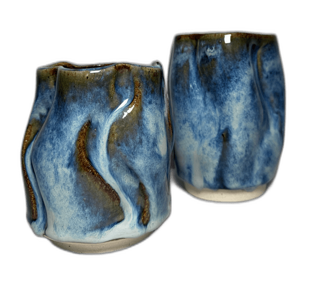 A blue-striped mug photographed in the studio