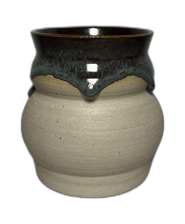 A side view of a ceramic pourer photographed in the studio