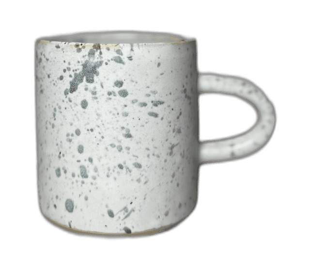 A second speckled mug photographed in the studio