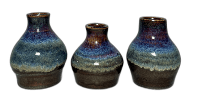 A trio of blue-glazed ceramic vessels photographed in the studio
