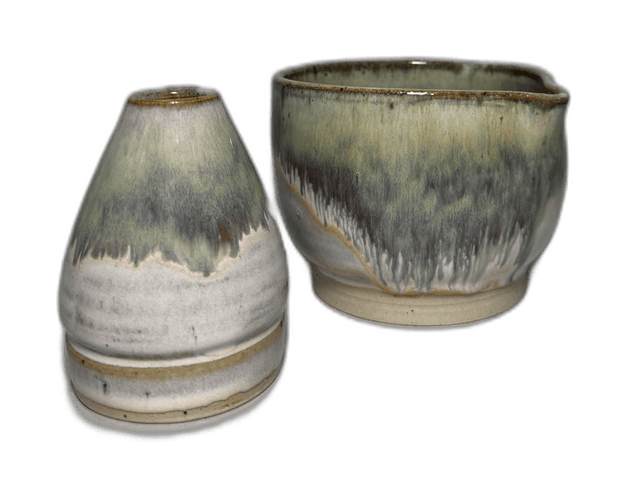 A mixed pair of handmade vessels photographed in the studio