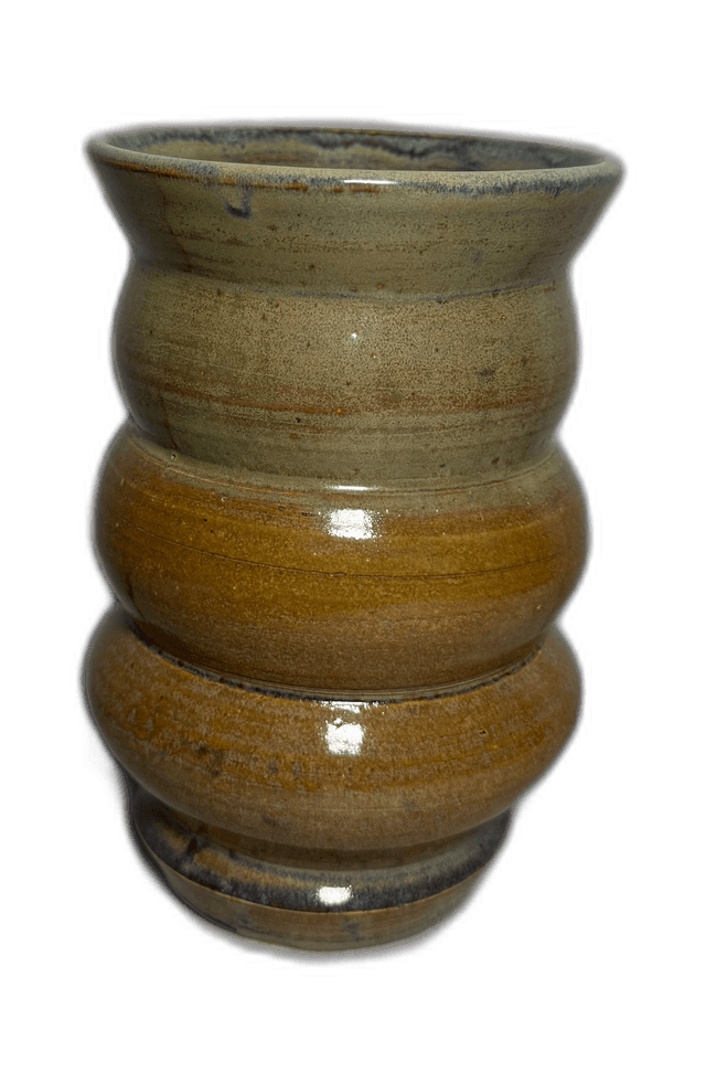 A stacked set of ochre-toned ceramic vessels